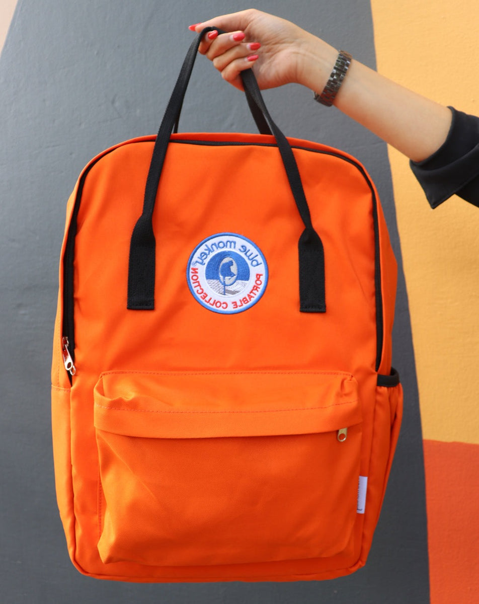 Orange Backpack Blue Monkey New Attitude Beverage Corporation